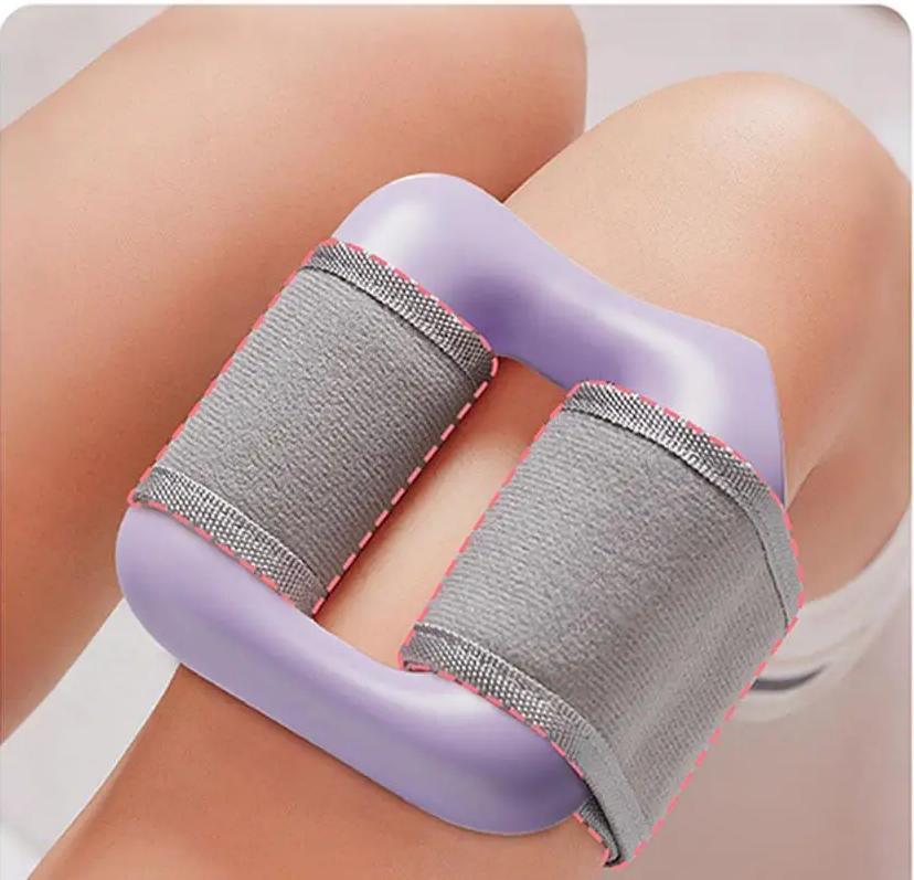 Purple thigh exerciser with gray straps for leg muscle training and fitness workouts